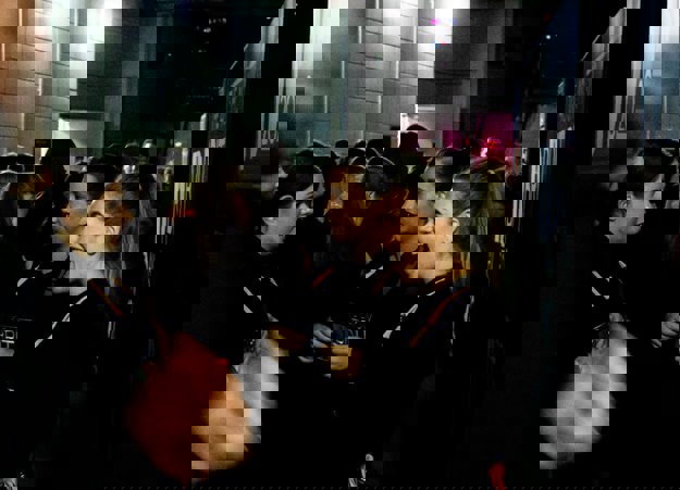 A group of Constellation waiting staff smiling and laughing behind the scenes at the BRIT Awards.